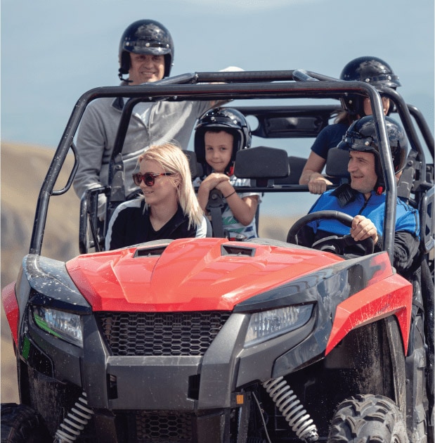 Family of five riding in UTV