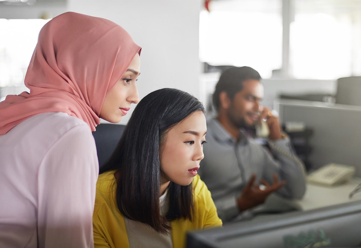 A diverse group of coworkers in an engaged work environment